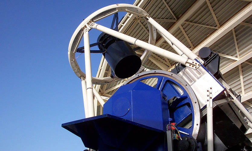 The metal framework of the Liverpool Telescope situated in La Palma, Canary Islands, pointing to the sky during daylight