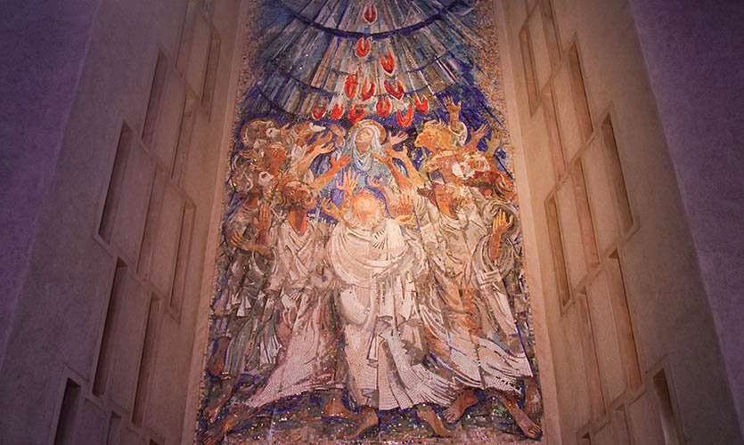 A large rectangular mosaic on the wall of Liverpool’s Metropolian Cathedral depicting Jesus Christ with his Apostles on the Christian Holiday of Pentecost