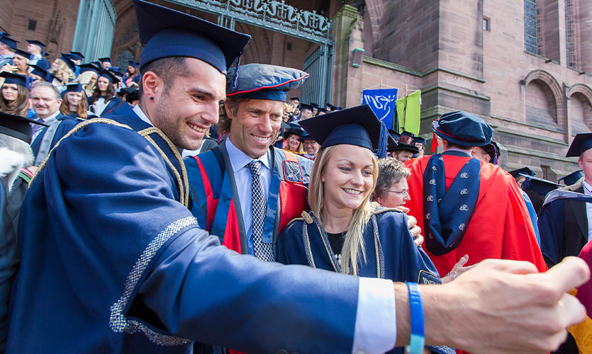 John Bishop taking a selfie at a graduation ceremony in July 2014