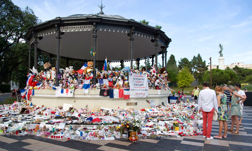 Bandstand in Nice used as a memorial with flowers and French flags