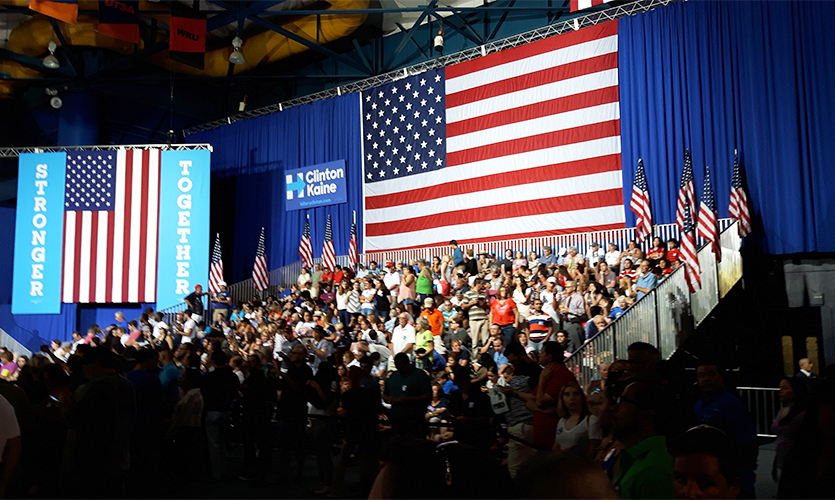 A stand with spectators at a Clinton rally