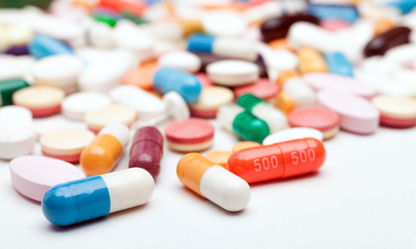 Group of colourful pills and drug capsules