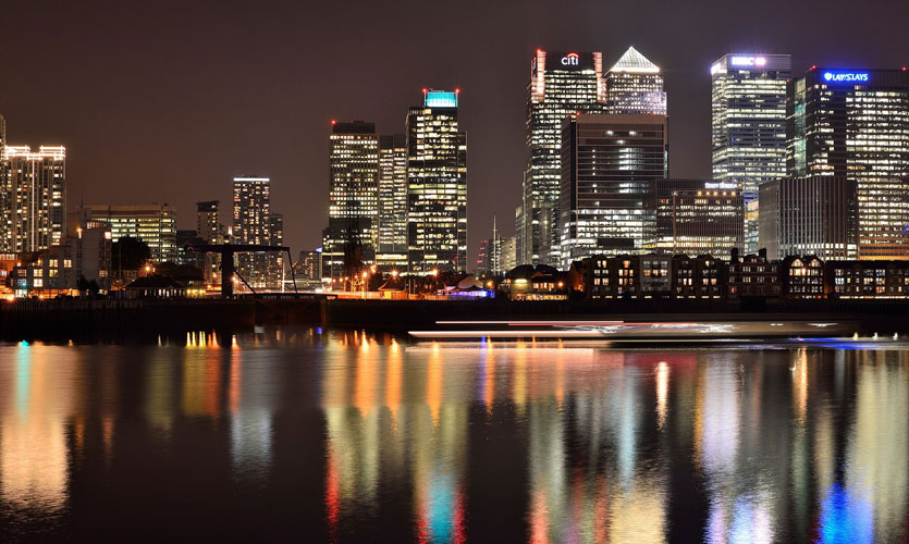Canary Wharf at night reflected in the Thames