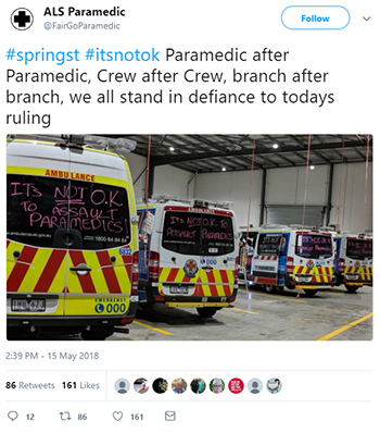 A tweet from @FairGoParamedic reading '#springst #itsnotok Paramedic after Paramedic, Crew after Crew, branch after branch, we all stand in defiance to todays ruling', with a photo of anti-assault messages written on the backs of ambulances