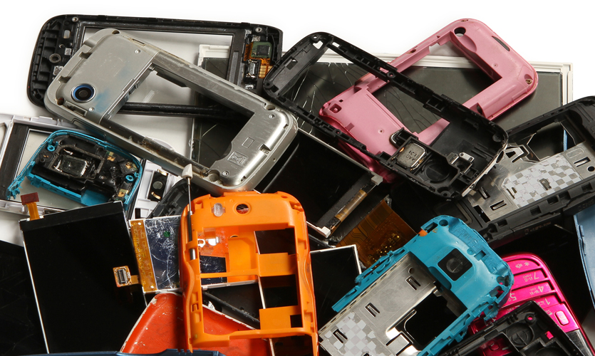 A pile of old mobile phone cases and parts
