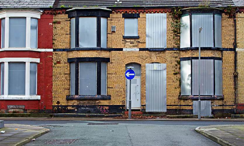 Social exclusion: boarded-up homes in Liverpool, UK. Shutterstock.