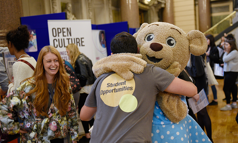 Claire Bear gets a hug during LJMU’s welcome event for new students in St George’s Hall. 