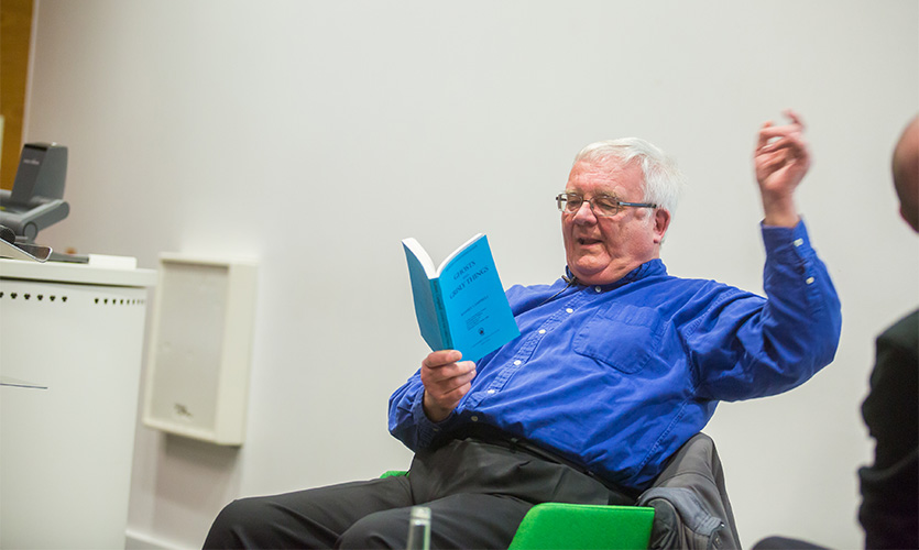 Ramsey Campbell reading from one of his books.