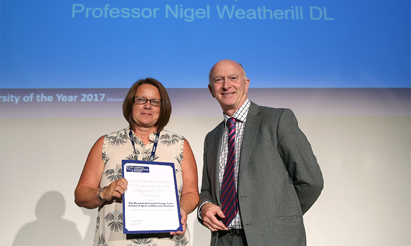 Dr Zoe Knowles receiving the award on the behalf of the Physical Activity Exchange from LJMU Vice-Chancellor Professor Nigel Weatherill