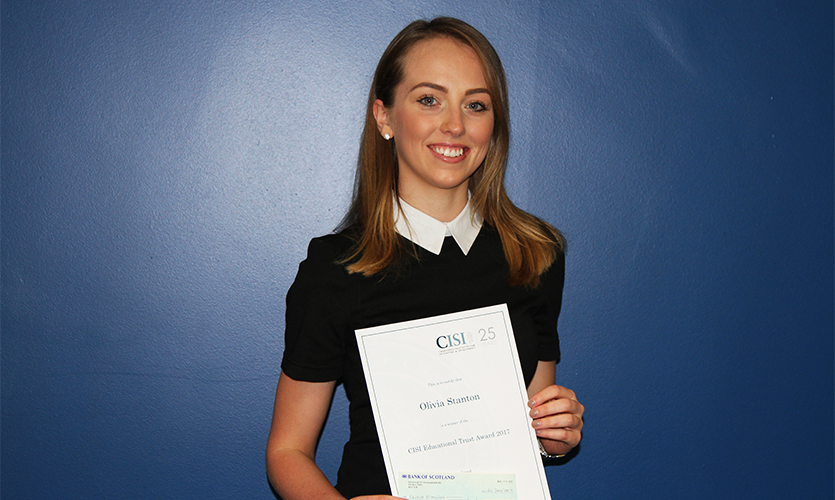Olivia Stanton holding her CISI Educational Trust Award