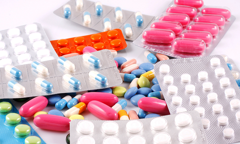 Image of pills piled together on a white surface