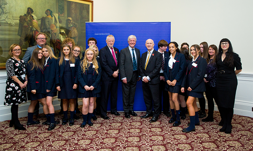 Group shot showing Lord Hall of Birkenhead with the 13 school pupils who won the Good Citizenship Award