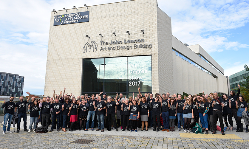 Image of staff and students stood outside the John Lennon Art and Design Building