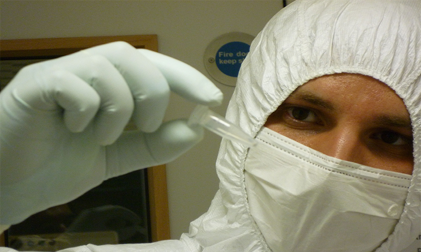 1.	Linus Girdland-Flink working in the ancient DNA laboratory. To avoid introducing contaminant DNA, ancient DNA researchers dress up in full-body coveralls and face masks. Photo: Karolyn Shindler