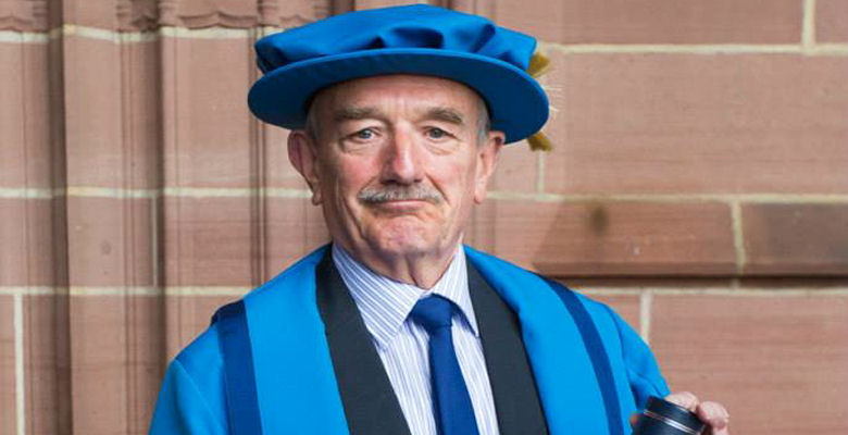 Image of David Charters in Honorary Fellow gown