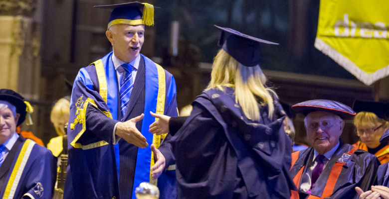 Image of LJMU Vice-Chancellor shaking hands with graduate