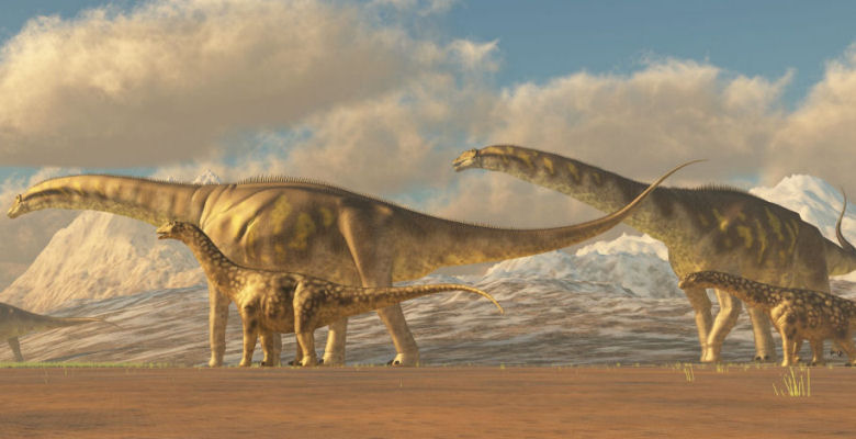 Image of four dinosaurs roaming barren land
