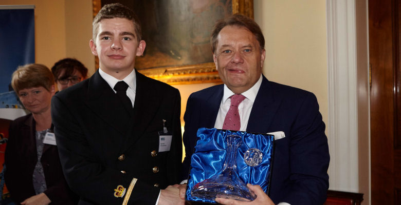 Image of Robert Bellis receiving his award from MP John Hayes
