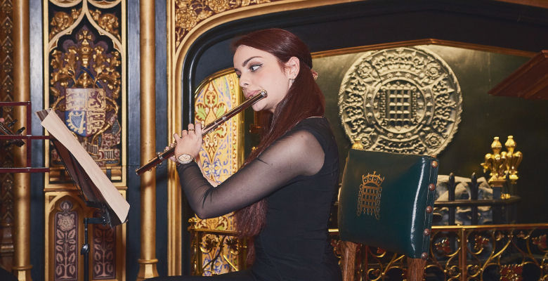 Image of student playing the flute in Speaker's House
