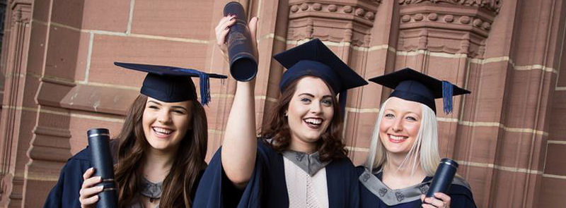 Image of Megan, Rachel and Melissa in cap and gown