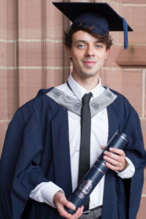Image of Lew Kelly in cap and gown