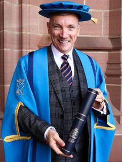 Image of Gary Millar in cap and gown