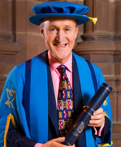 Image of Sir Peter Bazalgette in his Honorary Fellow cap and gown