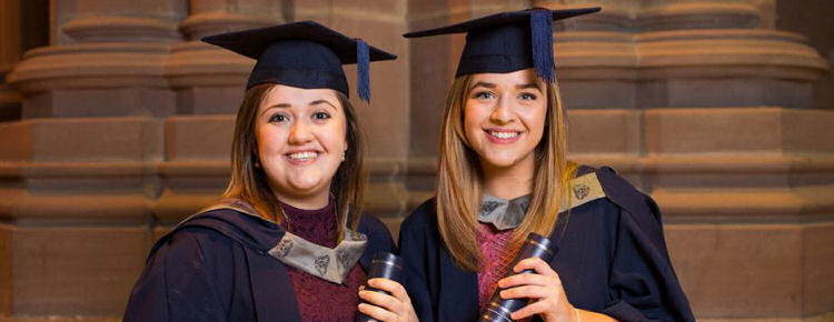 Image of Emma Channing and Harriet Sutcliffe in cap and gown