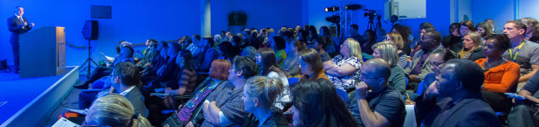 Image of the audience listening to speaker
