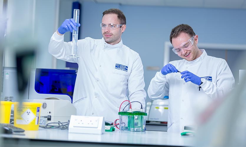 Two LJMU students in a science laboratory 