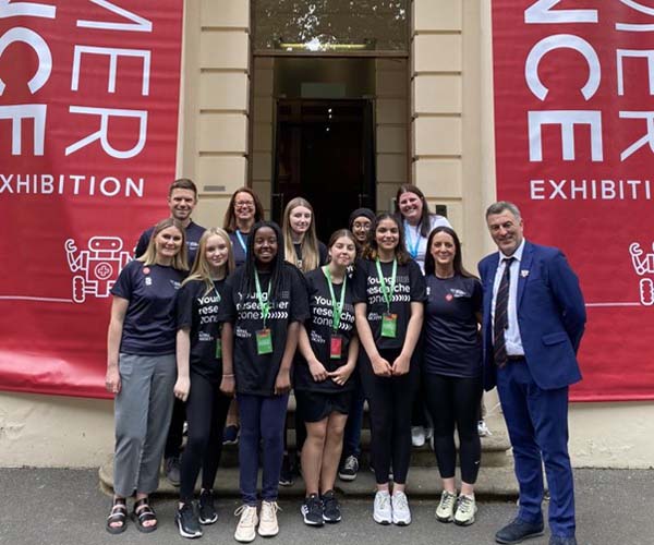 Image: LJMU Staff Dr Tori Sprung, Dr Lee Graves, Professor Zoe Knowles and Milly Blundell with Ian Byrne MP with staff and pupils from Holly Lodge Girls College. 