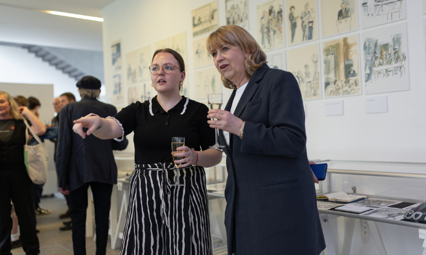 Exhibition student intern Madeleine Pedley stood with an LJMU member of staff