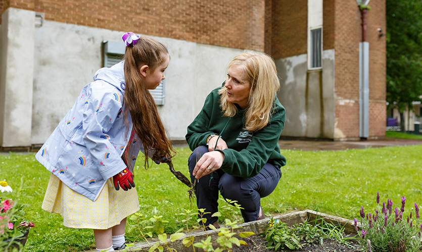 Image of child gardening at the Forest School