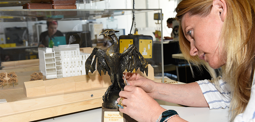 Image of Emma Rodgers working on a Liverbird sculpture