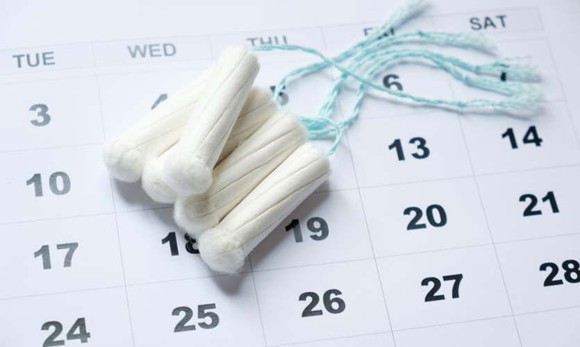 Tampons lying on a calendar