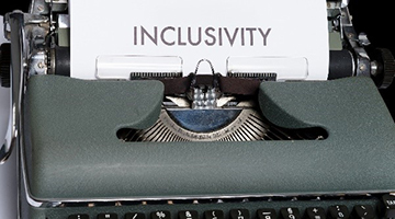 Typewriter with 'INCLUSIVITY' on the paper