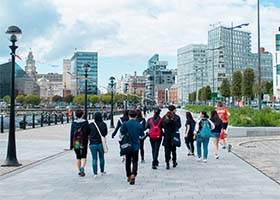 Students walking along the Liverpool waterfont