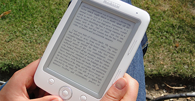 Image of a person holding an electronic book reader