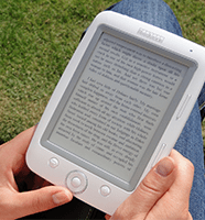 Image of a person holding an electronic book reader