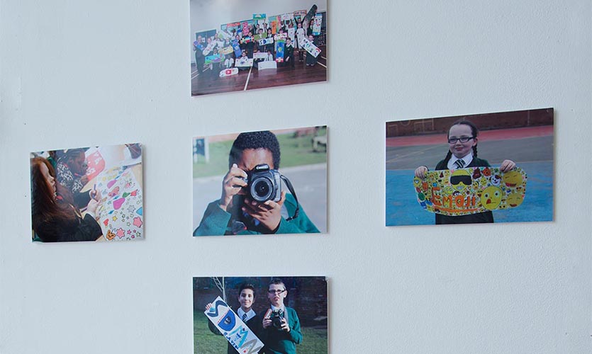Image of 5 photograph prints on a wall