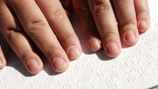 person reading braille